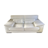 Three-seater white leather sofa
