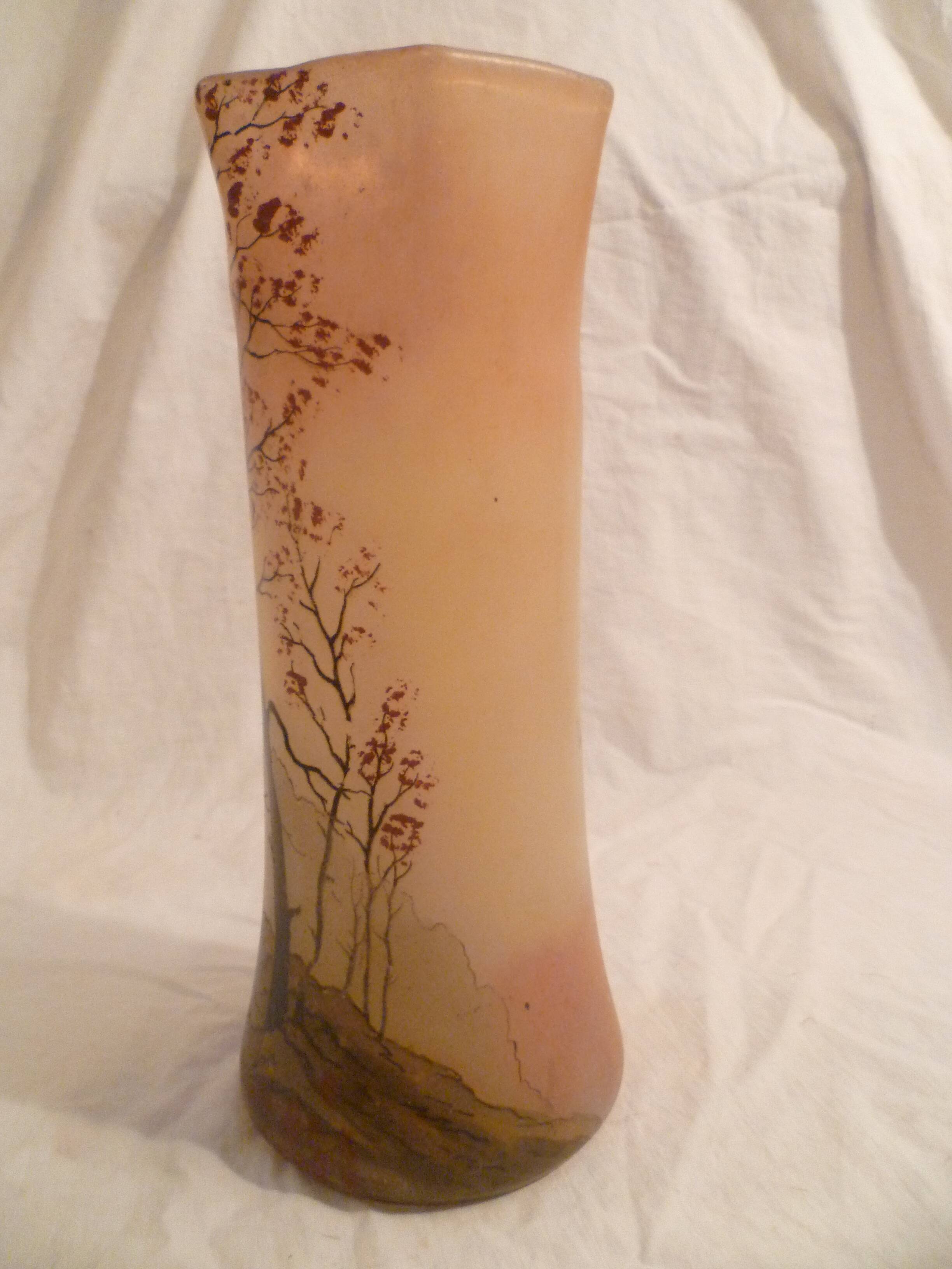 Blown glass vase with painted underbrush decoration marked "leg"