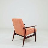 Mid-century modern armchair in coral red designed by H. Lis.