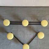 2 black and yellow metal wall coat racks