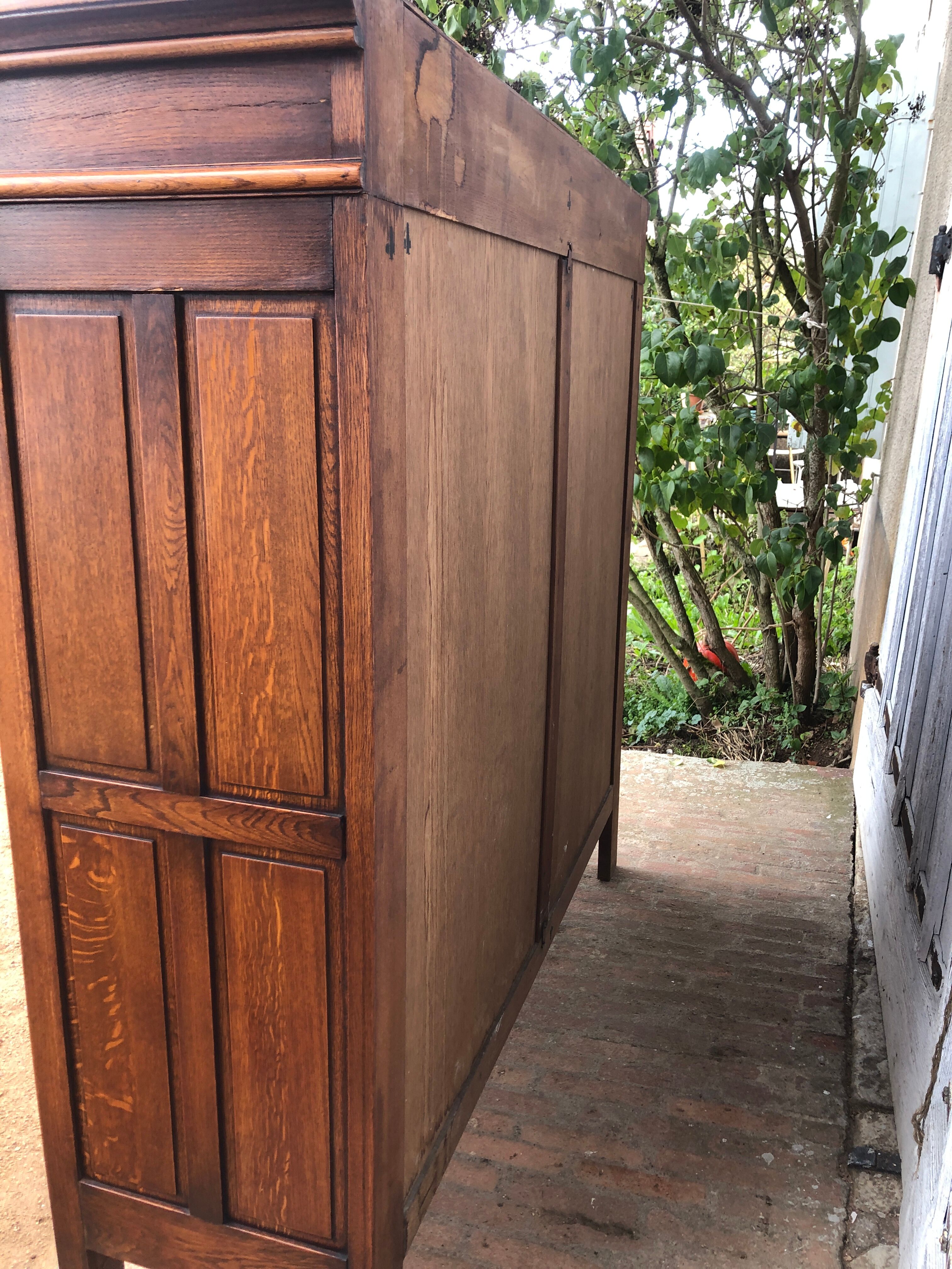 Spanish furniture with carved wood profiles and coats of arms from the 1950s.