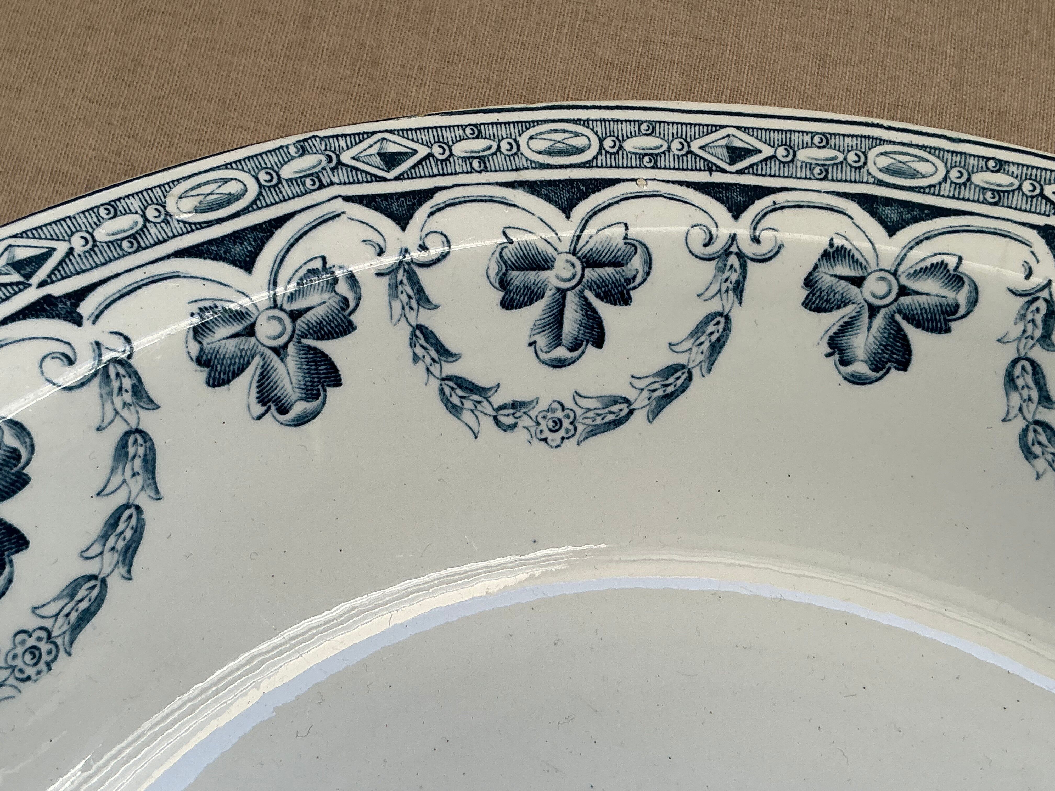 Old hollow dish in Ironstone with blue decoration by Amand & Hamage Santiago.
