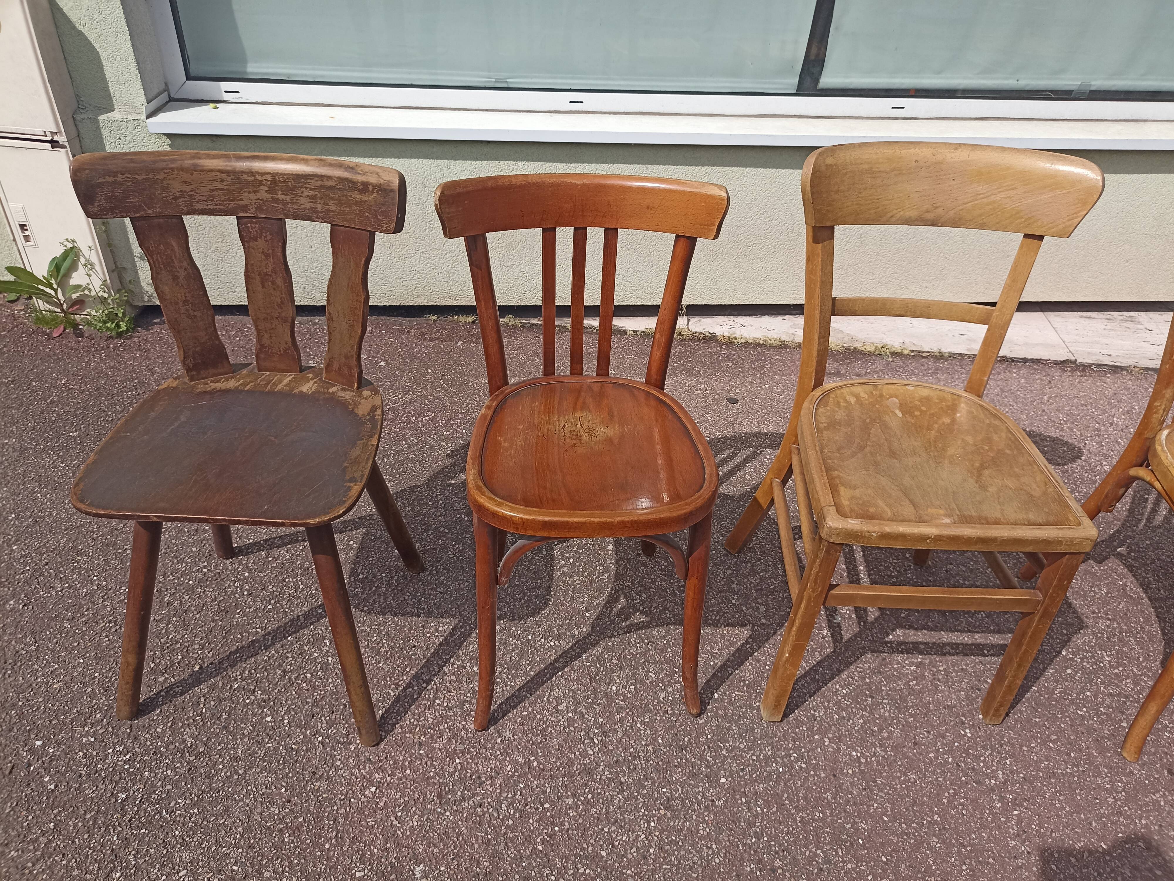 Set of 12 mismatched wooden bistro chairs