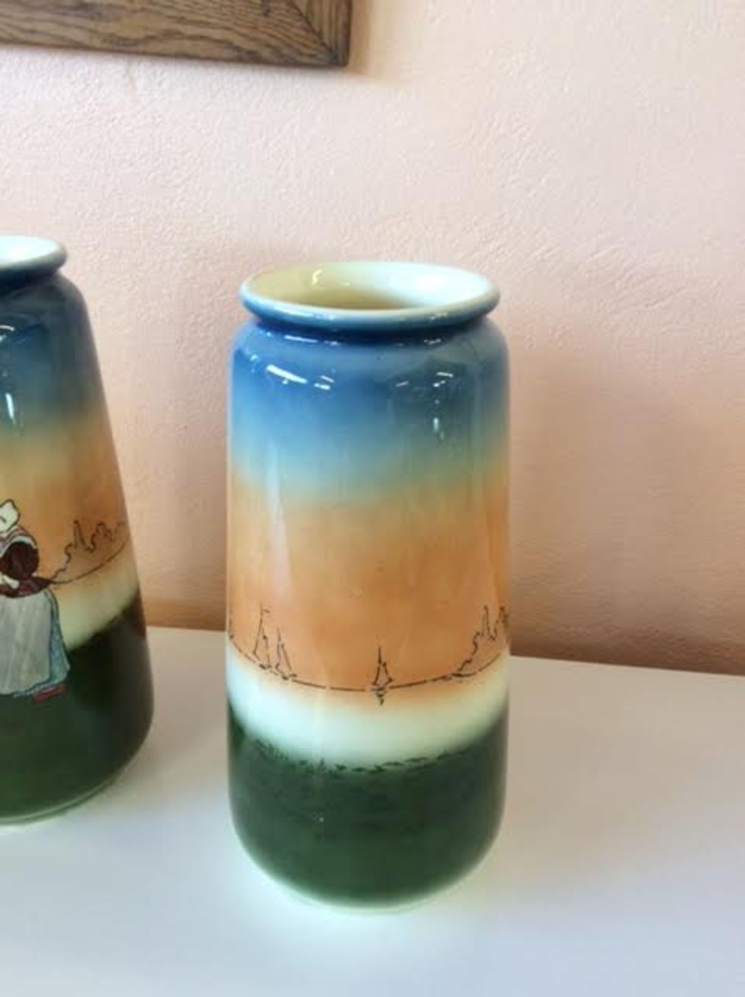 Pair of enamelled sandstone vases
