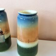 Pair of enamelled sandstone vases
