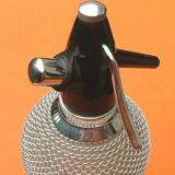 Seltz water siphon Glass body harmoniously meshed with translucent filaments