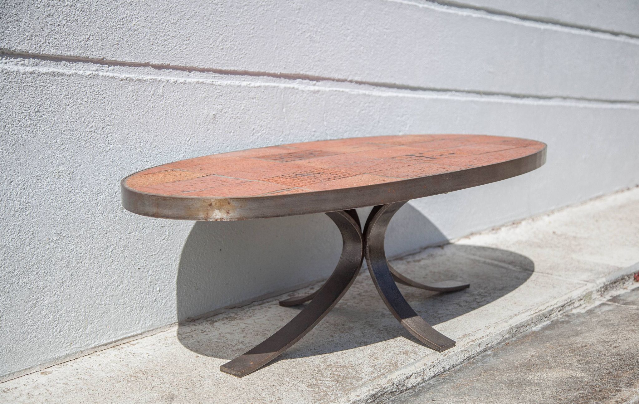 Table basse Jean Jaffeux, en pierre de lave émaillée avec structure en fer forgé, 60's