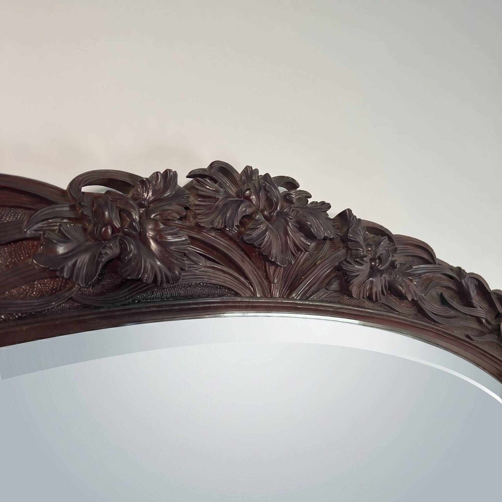 Large mirror (2 metres) Art Nouveau in carved mahogany with high-relief decoration.