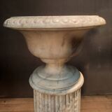 Column topped with a plaster basin.