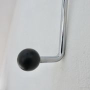 "Streamline" wall coat rack in chromed metal and black lacquered wood, 1970.