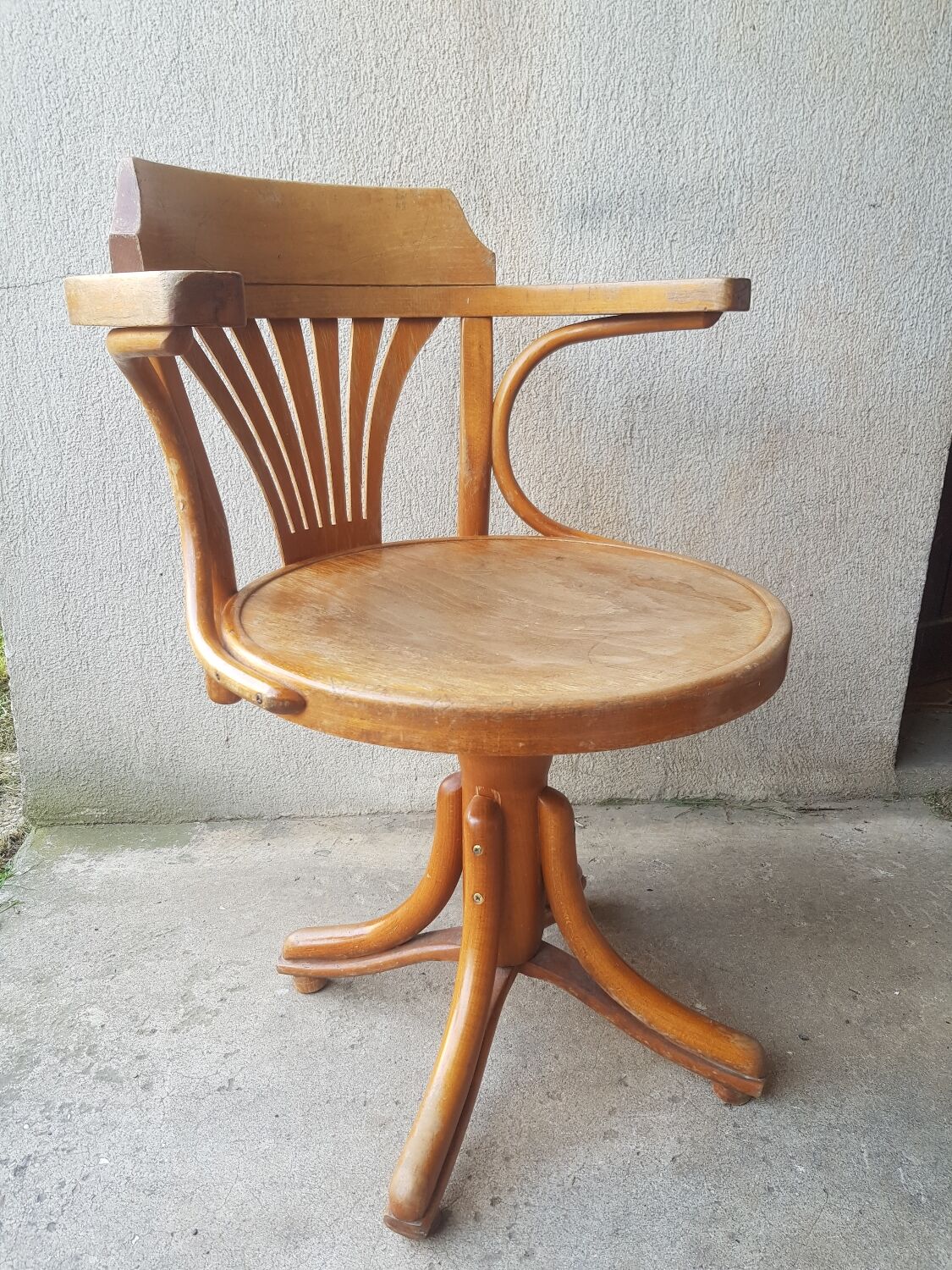 Swivel wooden armchair