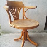 Swivel wooden armchair