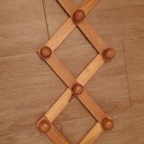 Accordion wall coat rack