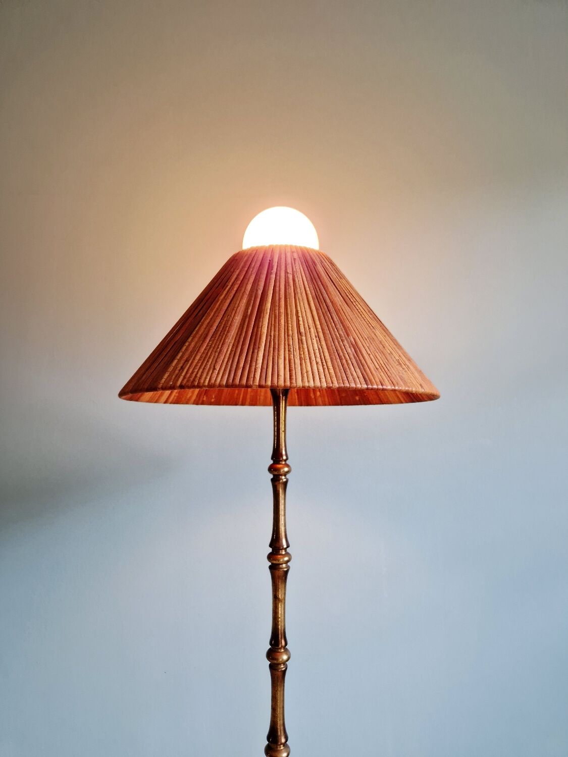 Brass floor lamp with rattan shade, 1950s-60s.