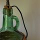 Lampe Dame-jeanne vintage en verre vert et rotin