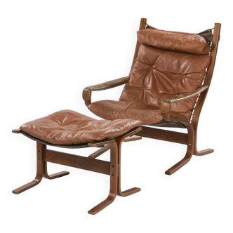 Fauteuil en cuir & ottoman by Ingmar Relling