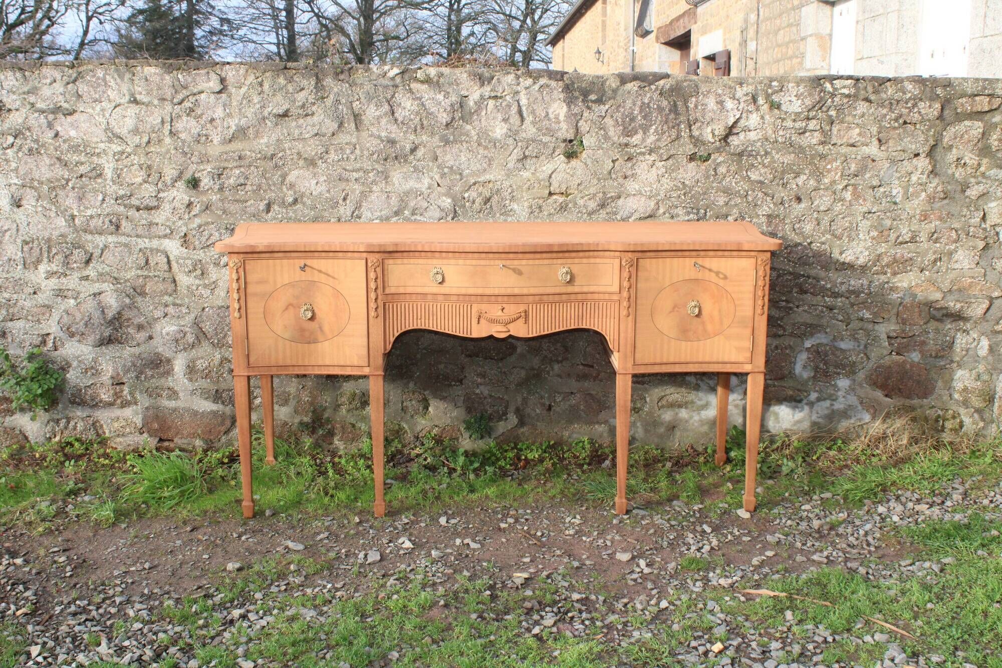 English-made enfilade in Louis XVI style with light wood veneers.