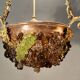Bronze three-armed chandelier with a grape decoration.