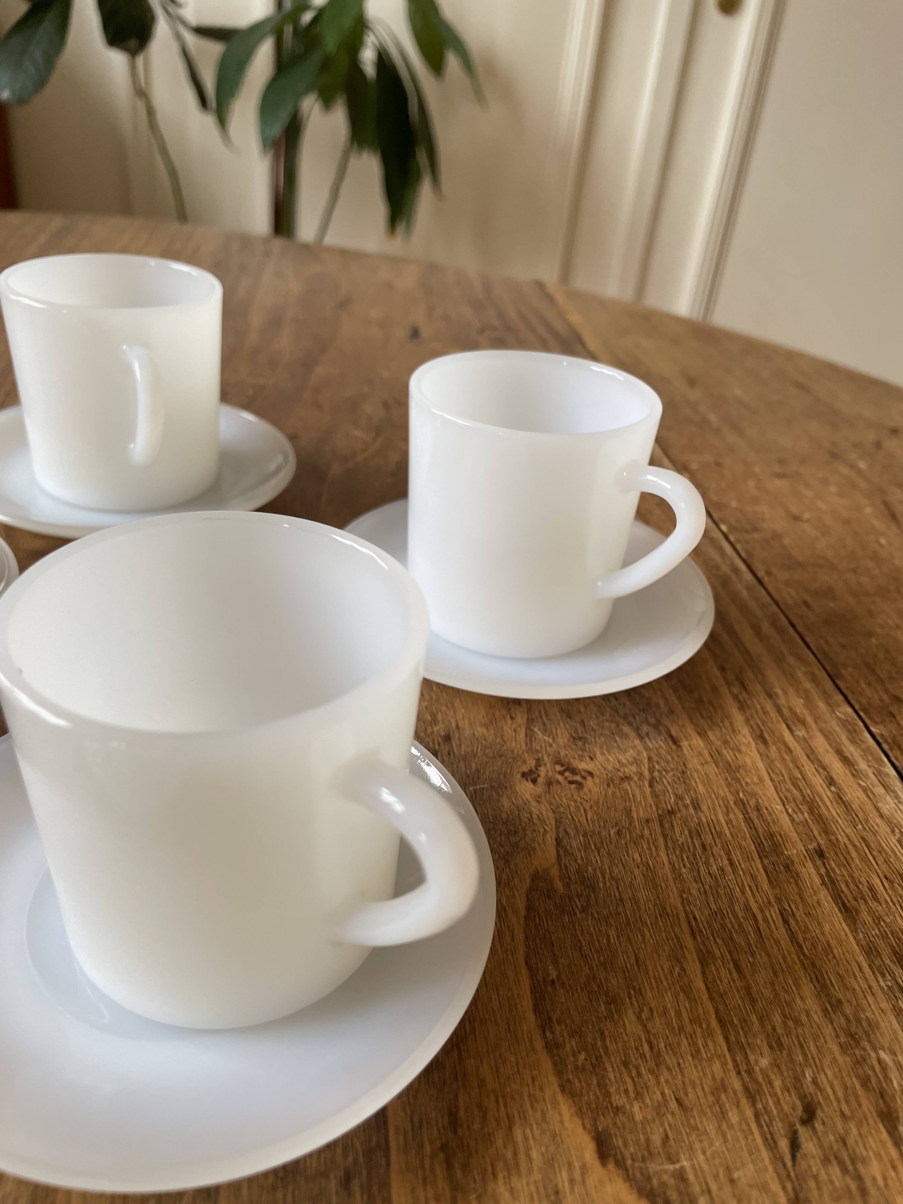 Espresso coffee cup service, Nestlé promotional items, in white glass.