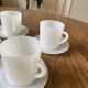 Espresso coffee cup service, Nestlé promotional items, in white glass.