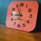 Vintage wall clock from the 50s in red formca