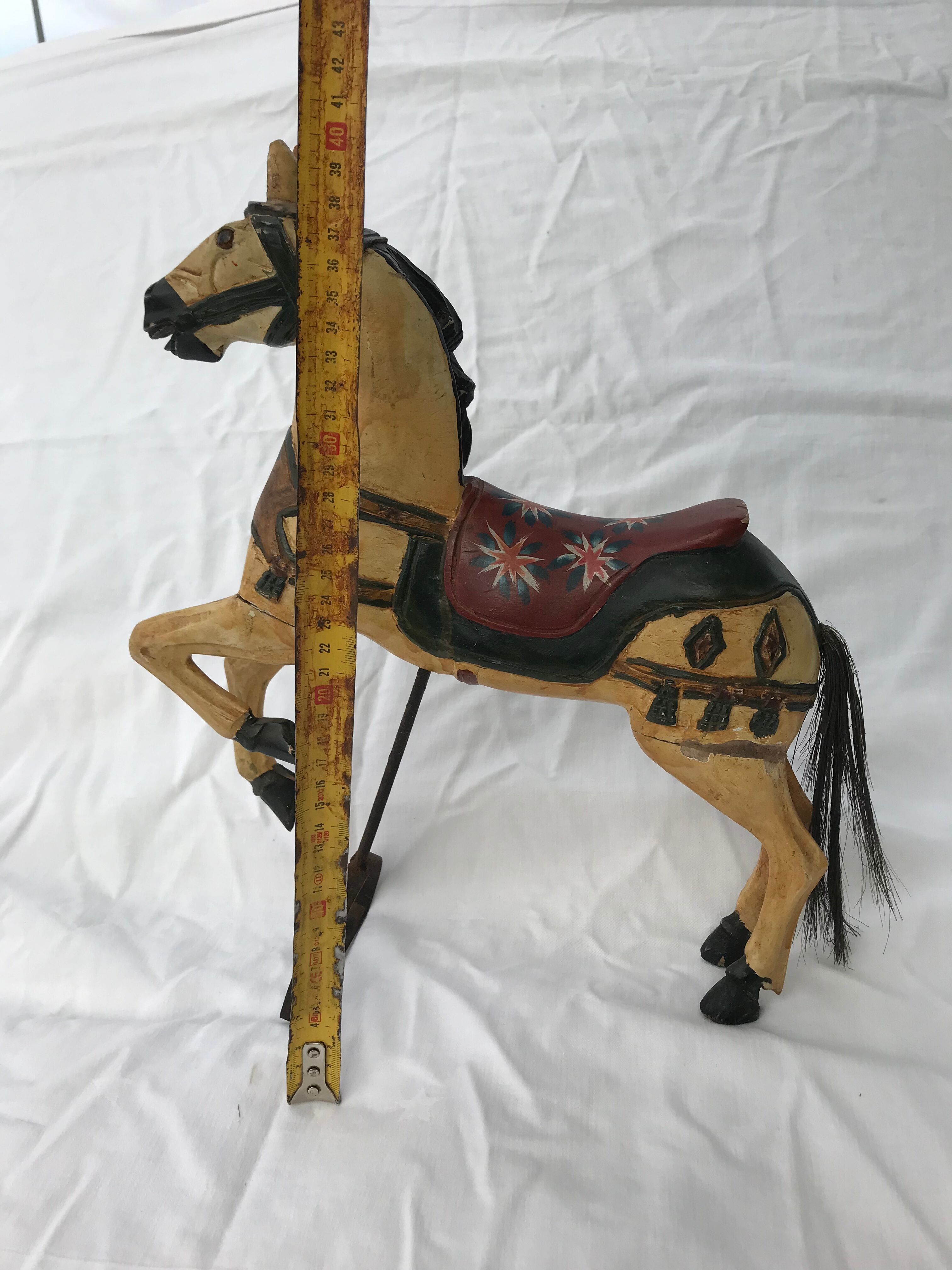 Wooden horse with period ironwork support