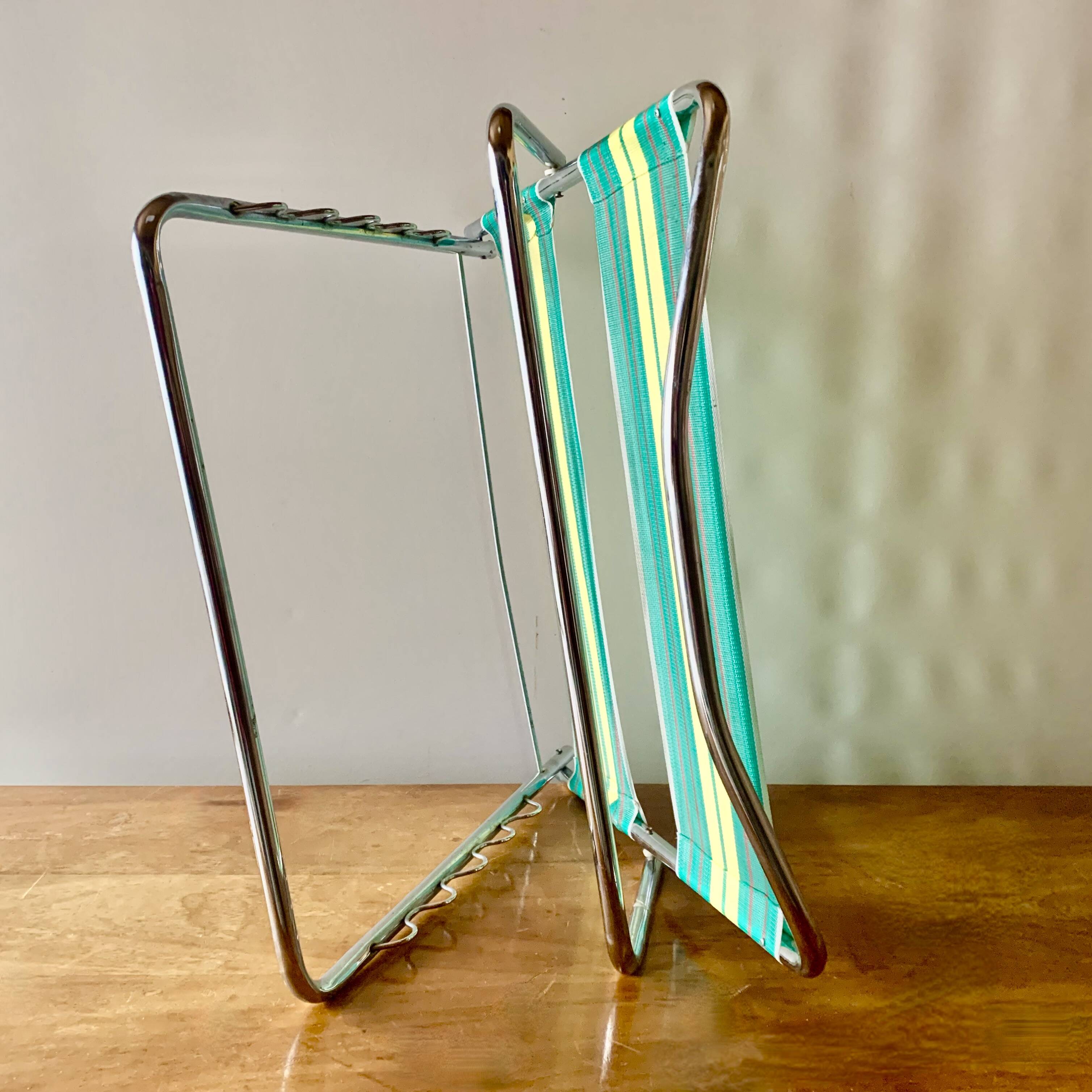 Vintage folding beach chair in chrome metal and woven plastic