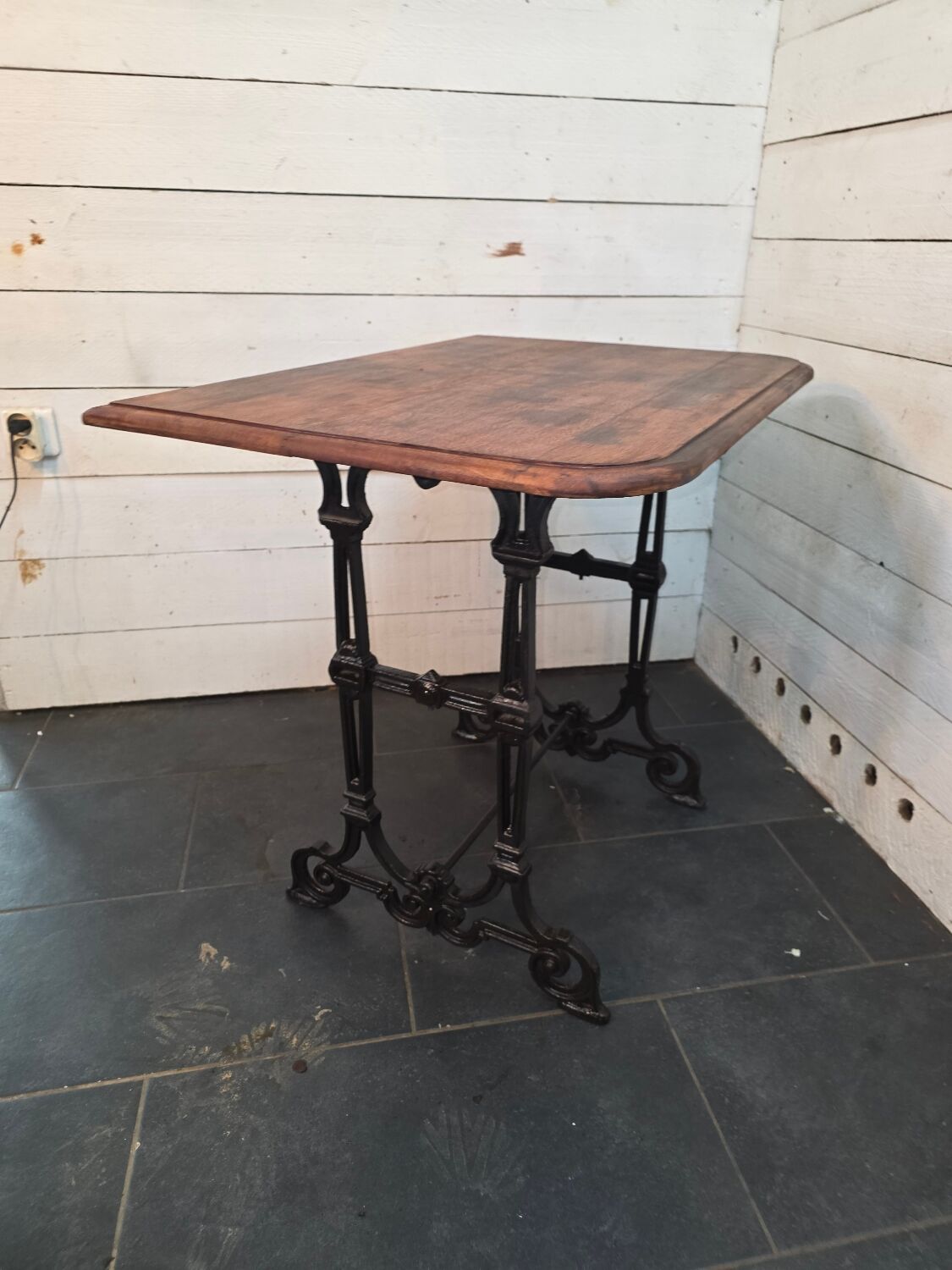 Bistro table with cast iron legs and oak top