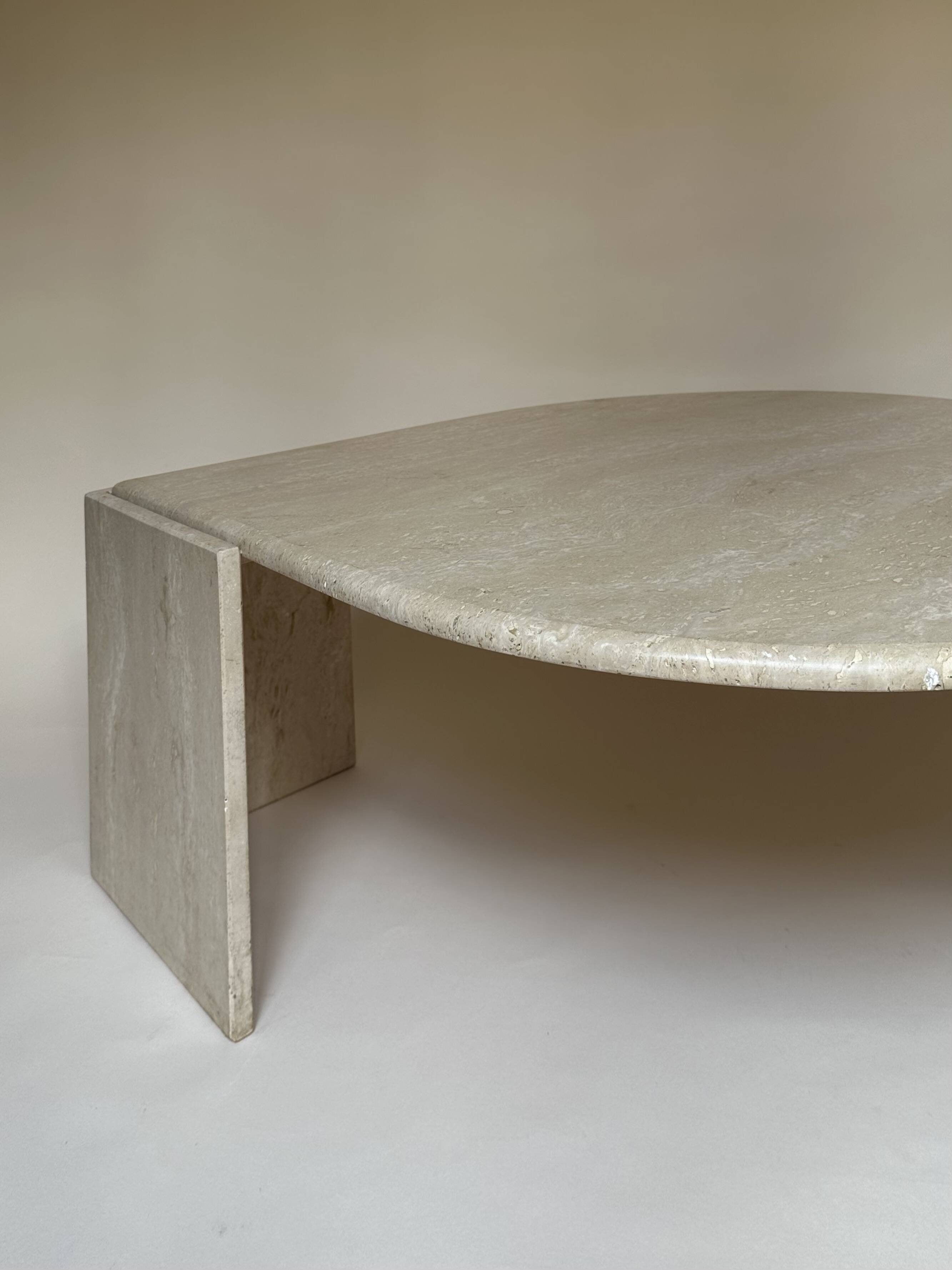Travertine eye-shaped coffee table