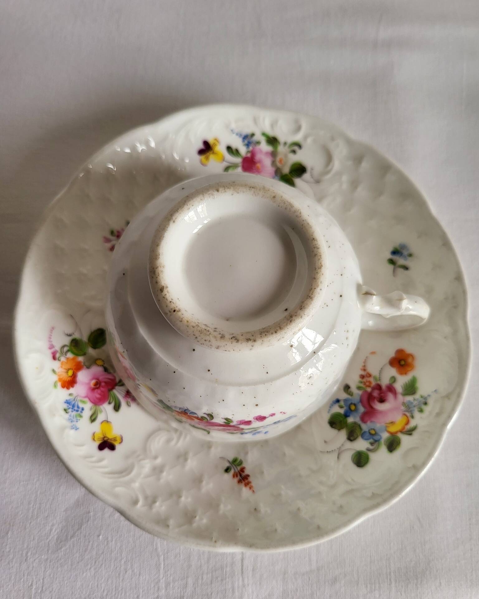Antique Cup and Saucer in Porcelain with Hand-Painted Floral Decoration