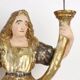 Antique wooden lacquered angel-shaped candlesticks, 18th century.