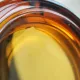Vintage Italian round ashtray in thick amber glass – Ø 15 cm