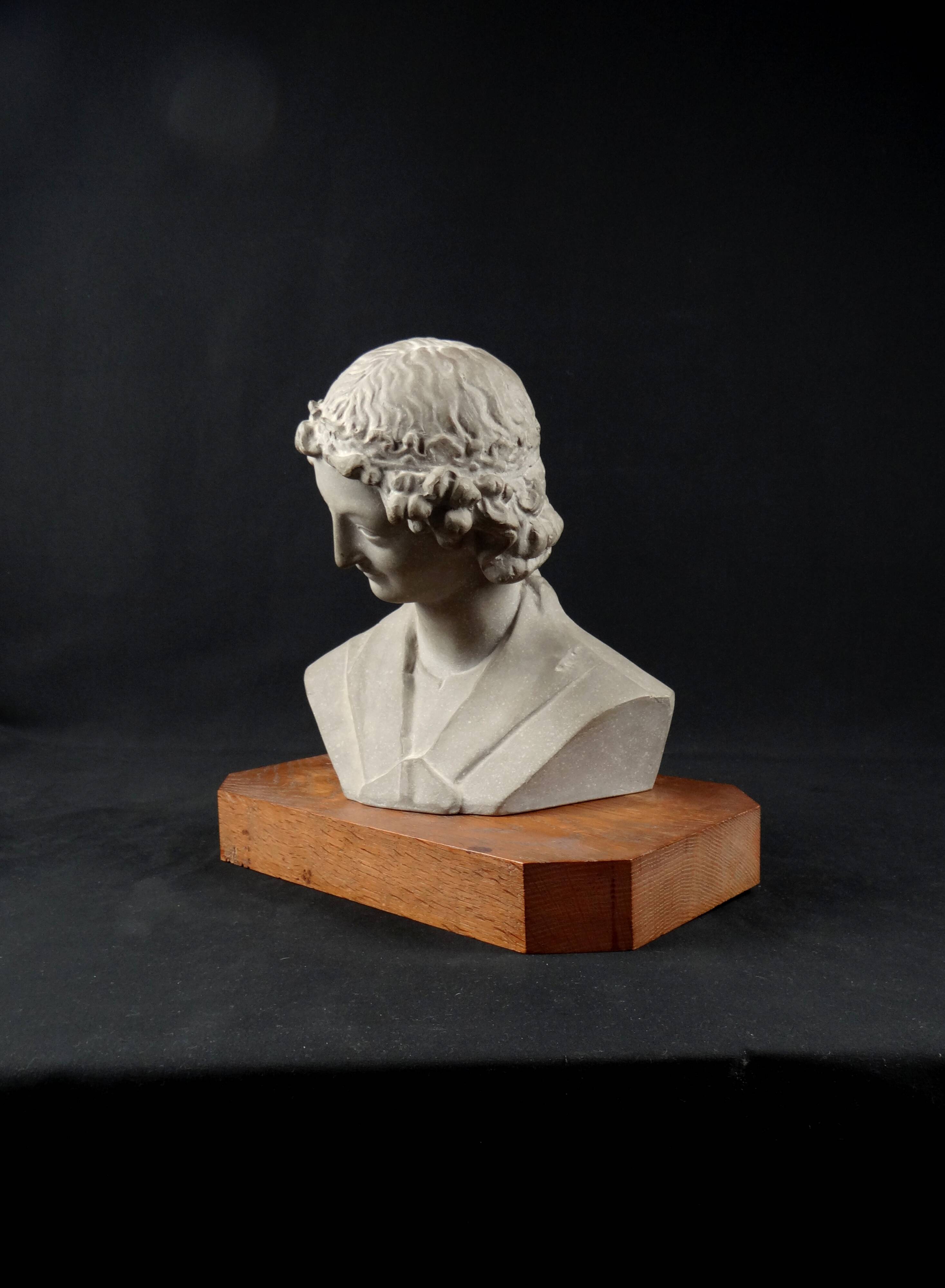 Terracotta bust of the smiling angel from Reims Cathedral with base