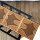 Magazine rack in ceramic and black, orange and brown iron from the 70s
