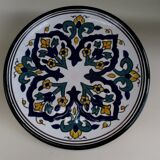 Round ceramic plate with hand-painted decoration