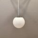 White hanging lamp with metal suspension, made with ball round opal glass shade.
