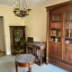Empire style chandelier with four lights in sheet metal, bronze with patina and gilding