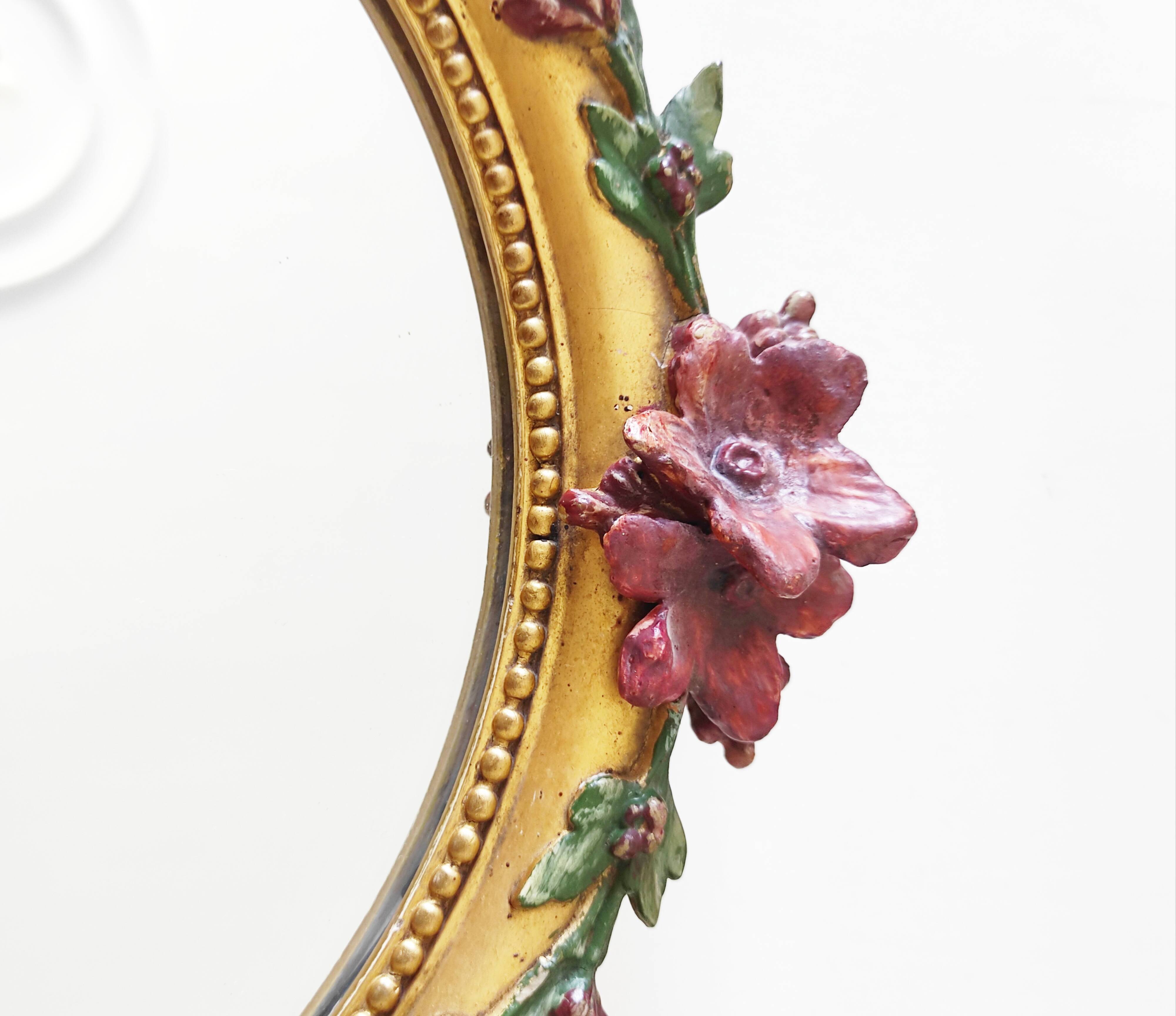 Miroir en bois doré avec fleurs