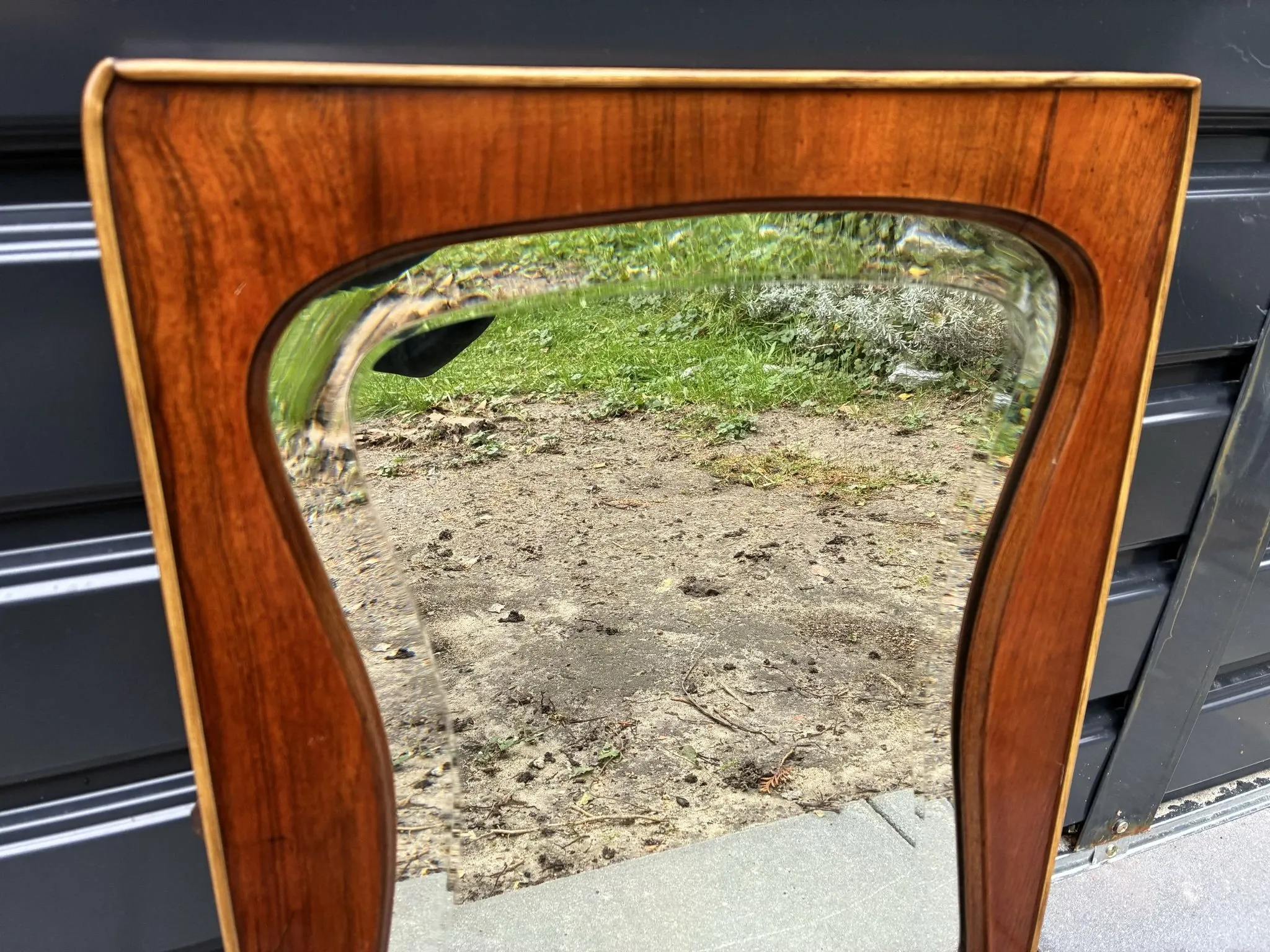 Mid-century organic shaped bevelled mirror in wooden frame, 1940s-50s
