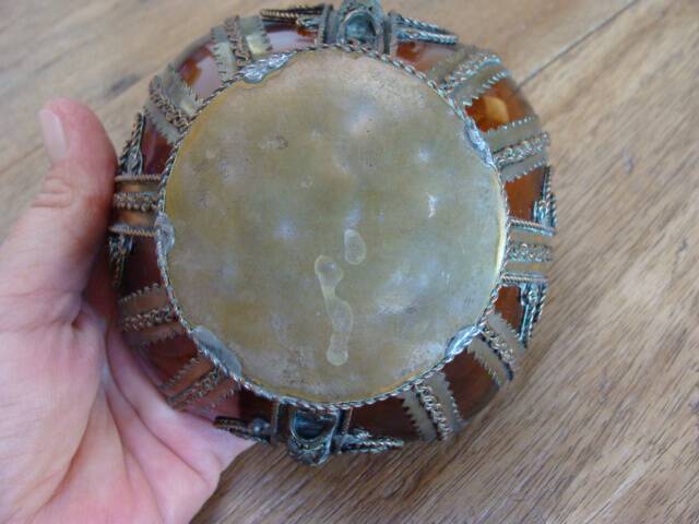 Small glass cup in metal frame