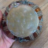 Small glass cup in metal frame