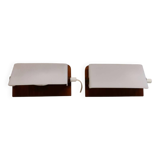 A pair of teak wood wall lamps with plastic shade.
