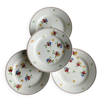 4 assiettes en céramique blanche décorées de motifs floraux colorés, gien.