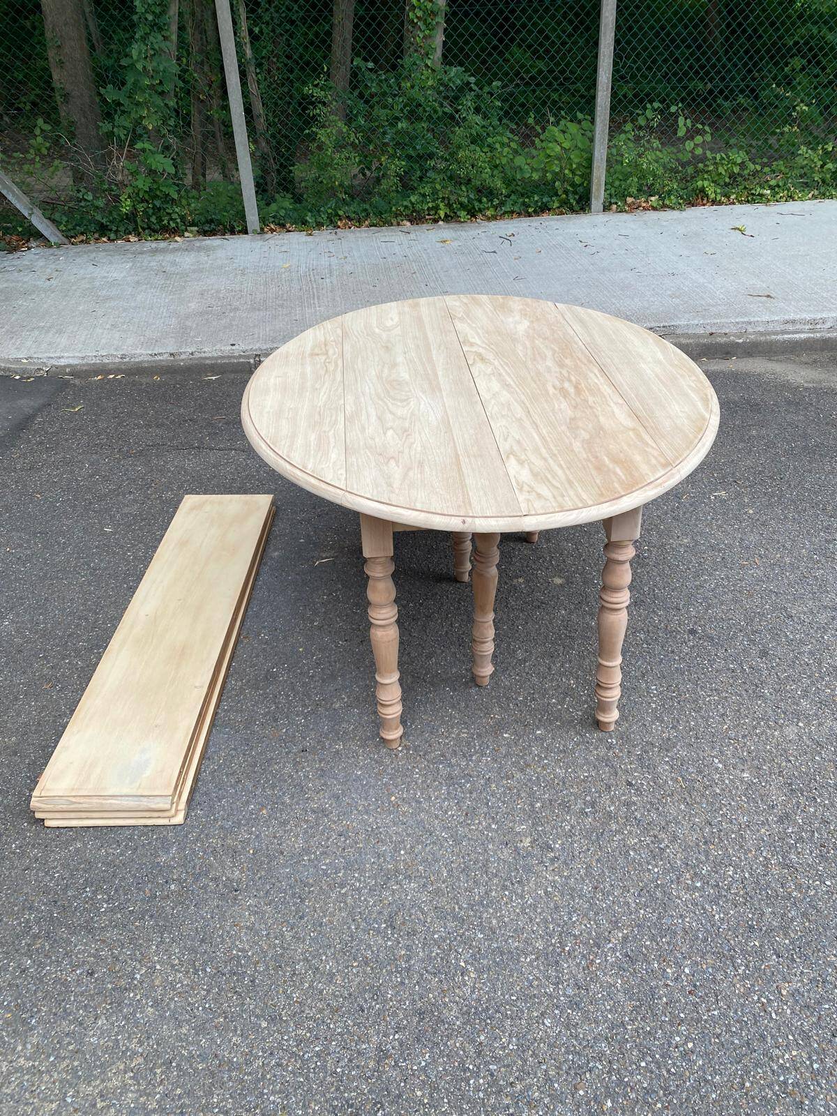 Renovated Louis Philippe round extendable dining table with flaps and 3 extensions.