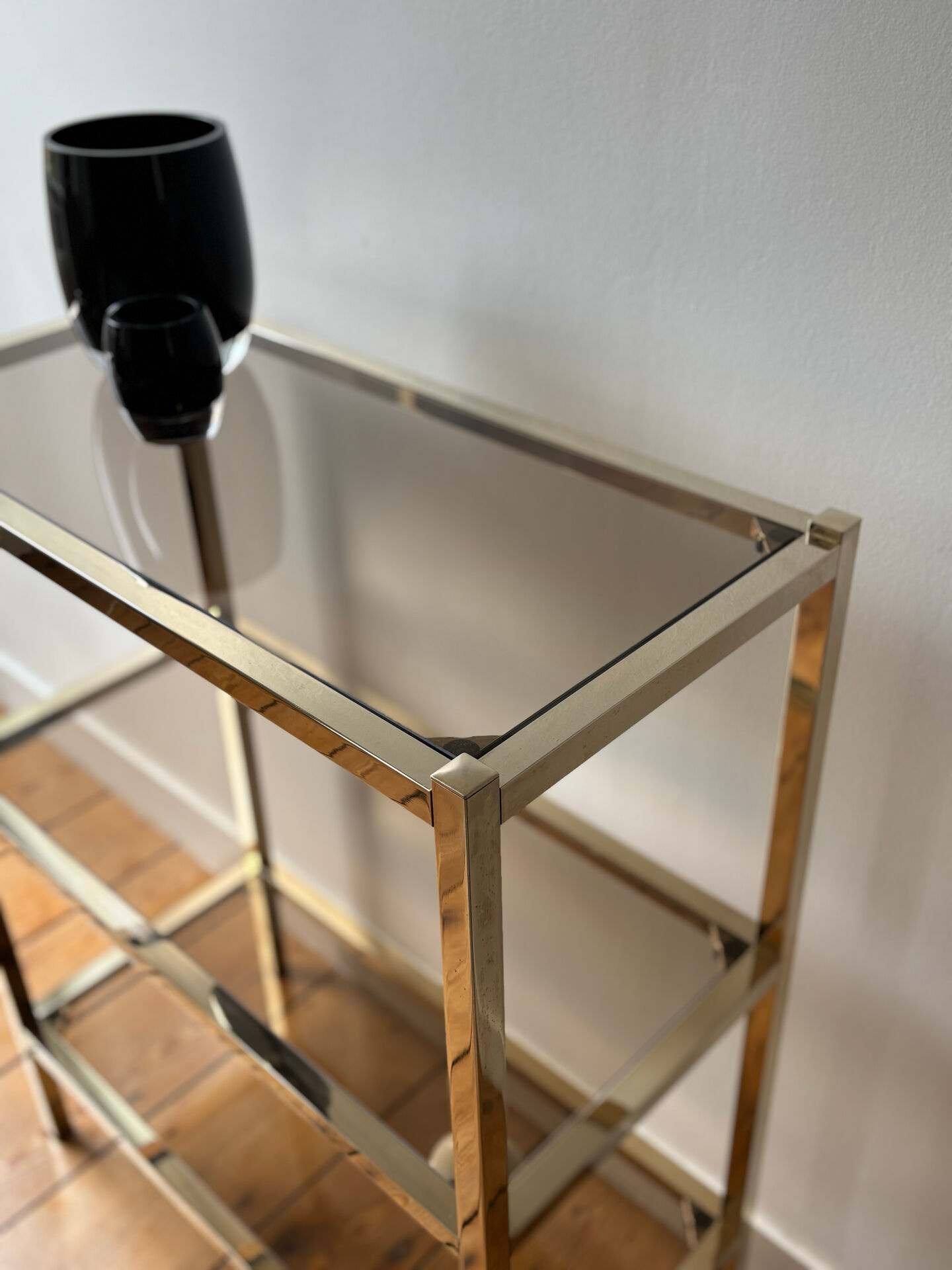 Brass and smoked glass library shelves