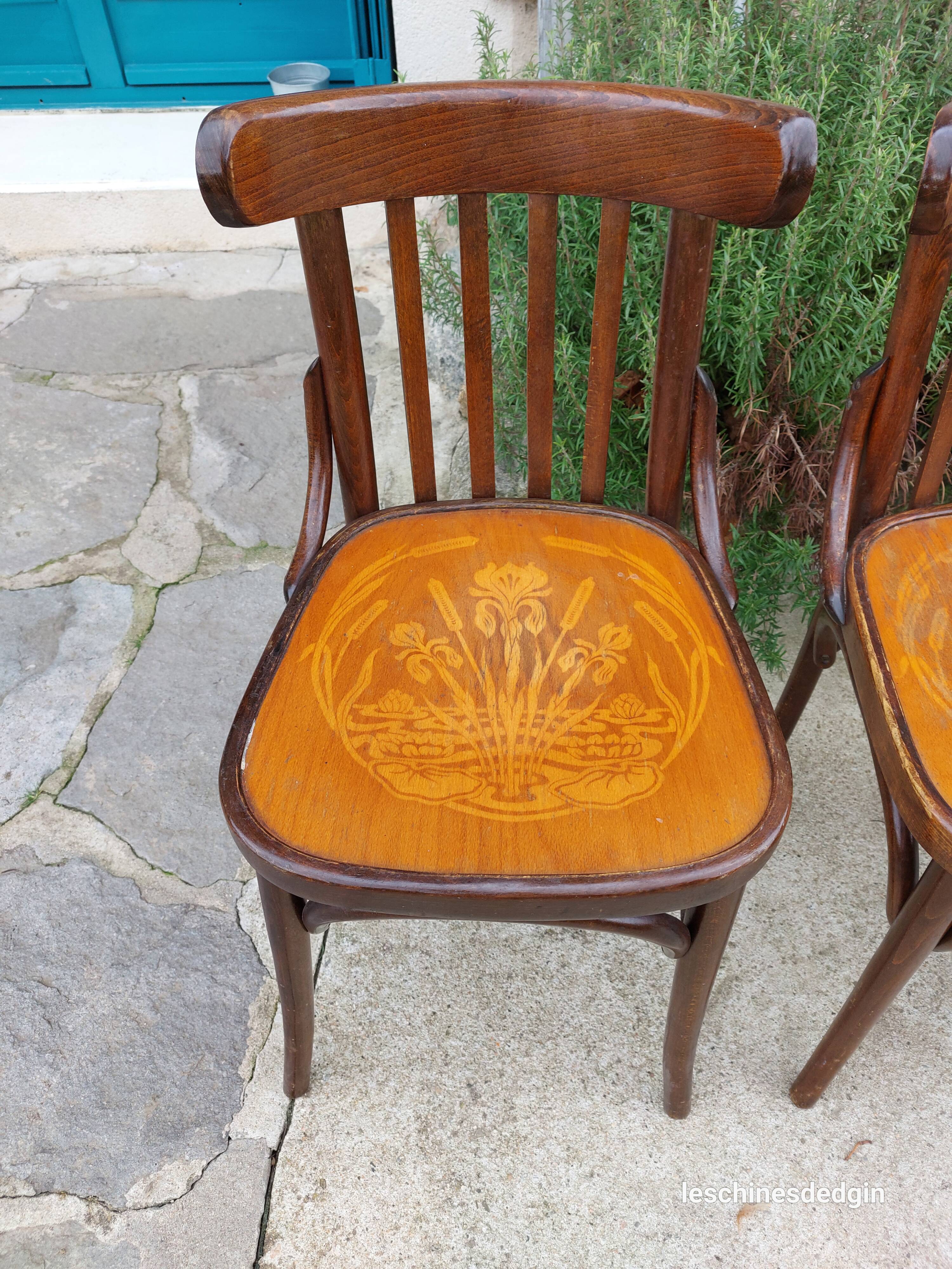 4 bentwood bistro chairs with a pattern on the seat