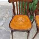 4 bentwood bistro chairs with a pattern on the seat
