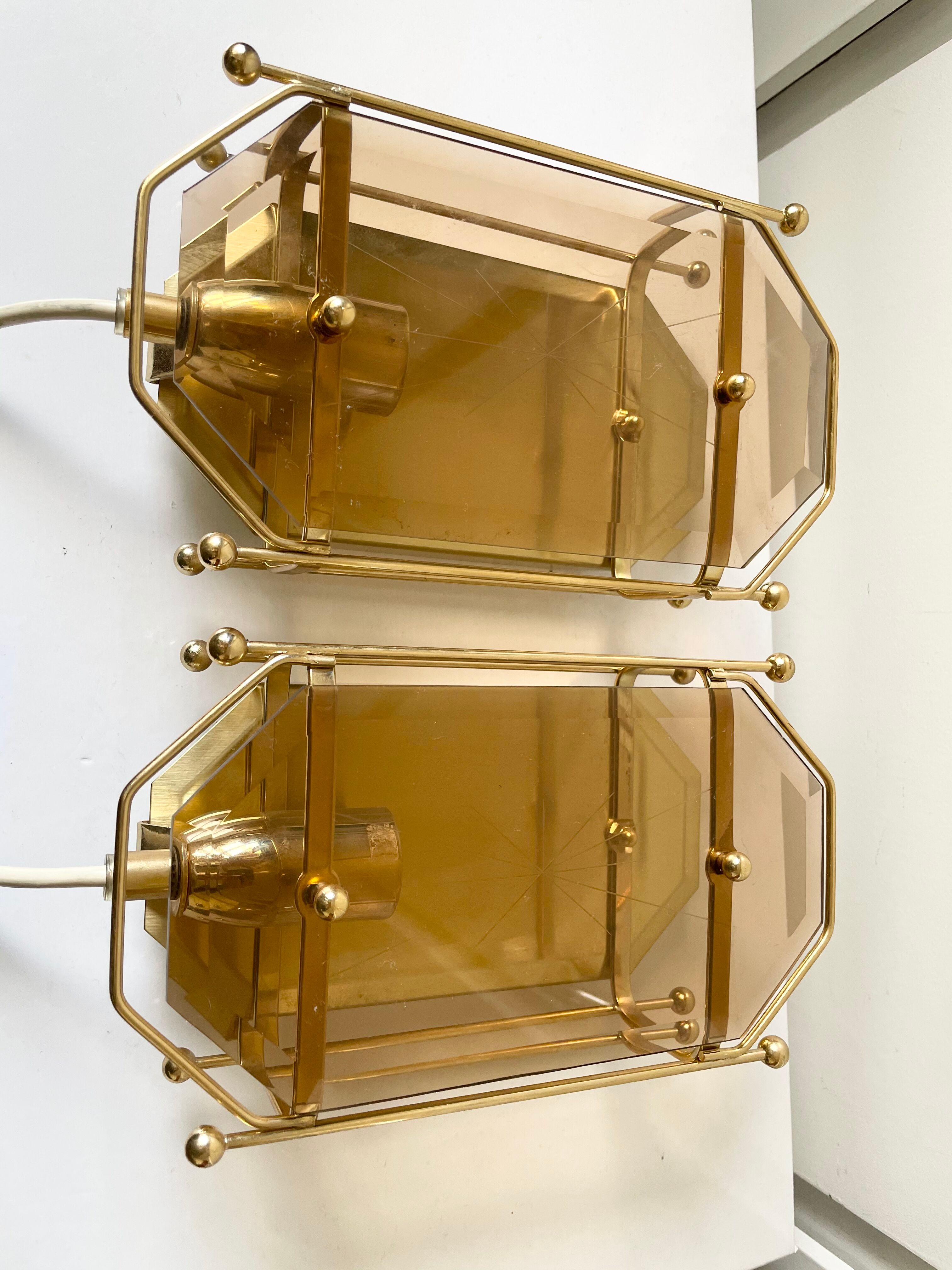 Pair of Scandinavian Vintage  wall light Sconce in Brass & Amber colored Glass