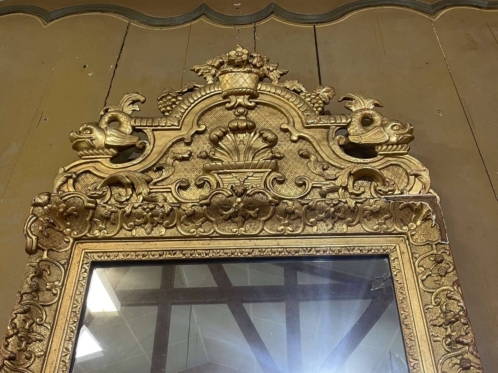 18th century Regency mirror in gilded wood