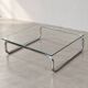 Coffee table in chrome with a glass top.